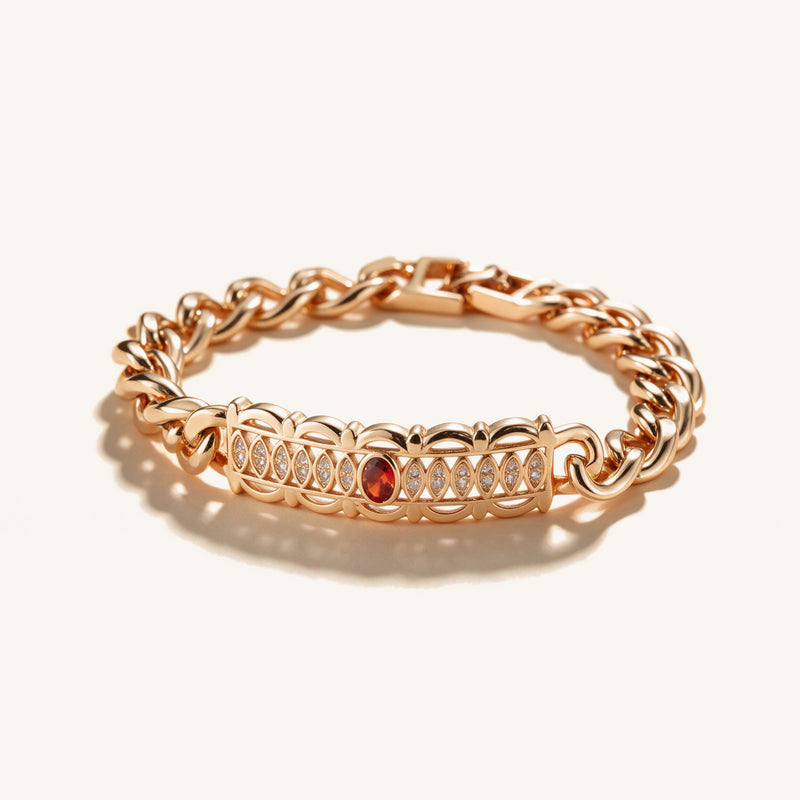 Bamboo & Ruby Twisted Bracelet — Rose gold-tone twisted chain with bamboo links, pavé crystals and a ruby-toned clasp (main v
