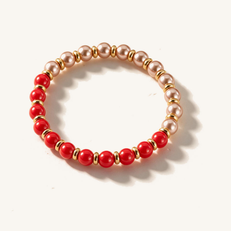 Rosewater Gradient Pearl Bracelet — Pink-to-red gradient pearl beads with gold-tone rings (main view)