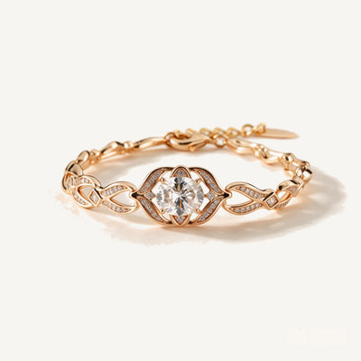Solitaire Twisted Bracelet — Twisted gold-tone links with a large crystal center and leaf-set pavé connectors (main view)