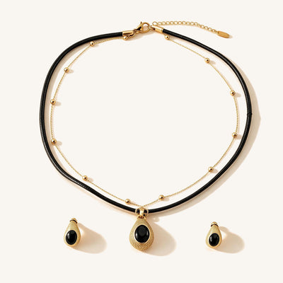 Noir Leather Necklace Set — Two-piece set with a black leather necklace and crystal-set earrings (main view)