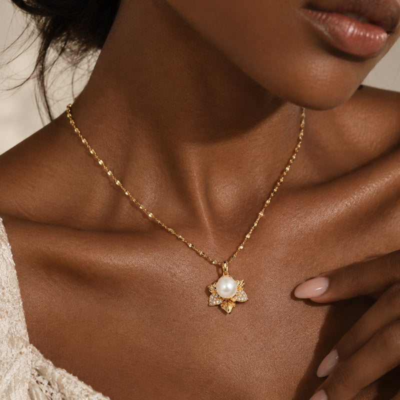 Petal Pearl Necklace — Flower-shaped pendant with a pearl center and crystal-set petals (close-up detail)