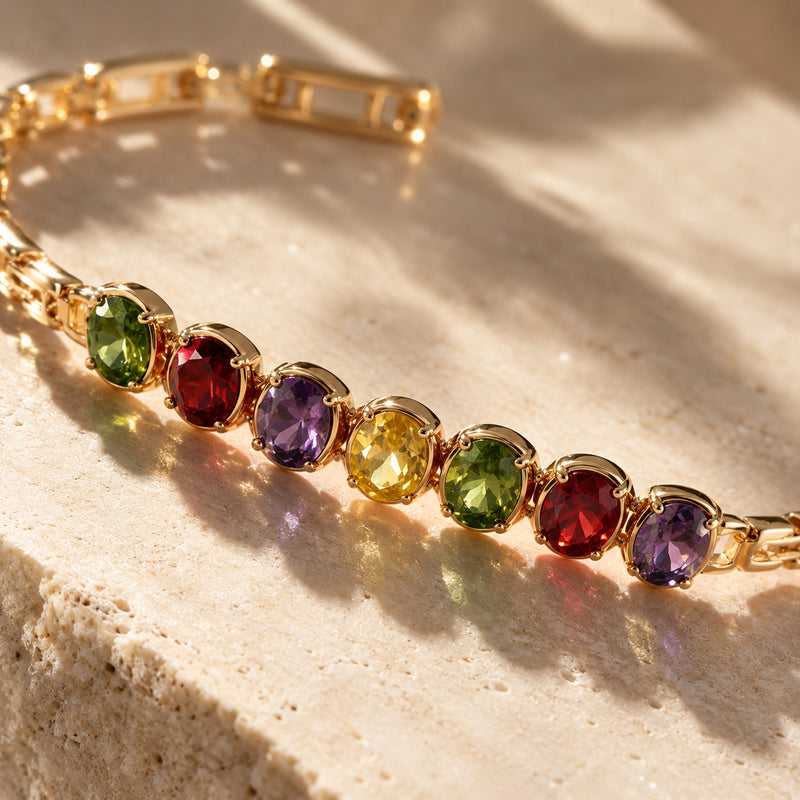 Gem Row Paperclip Bracelet — Rose gold-tone paperclip chain with a row of colored stones (styled on model)