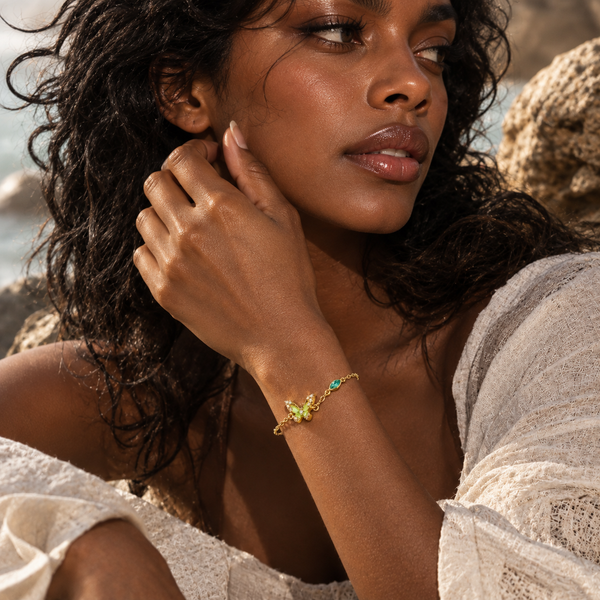 Close-up of emerald butterfly bracelet showing crystal-set wings detail