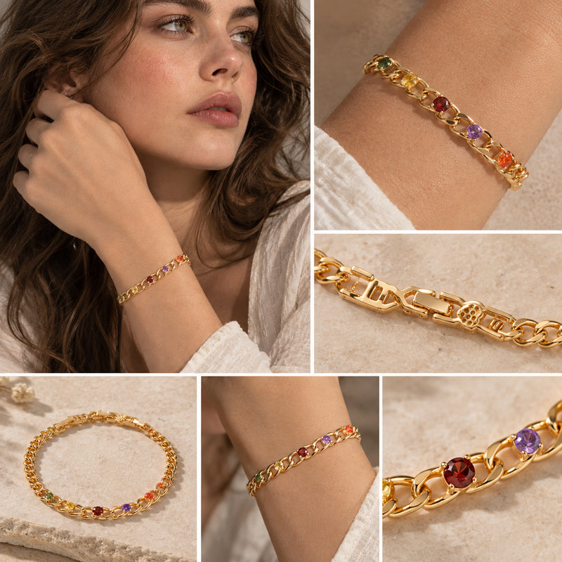 Rainbow Link Bracelet — Chunky gold-tone links with rainbow crystal accents (styled on model)
