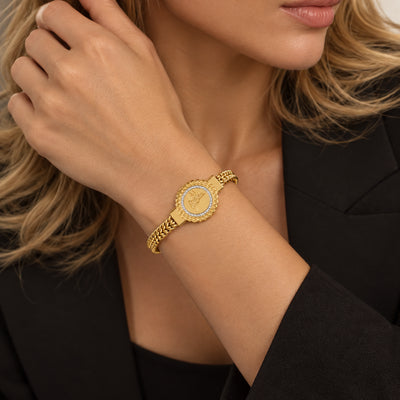 Monogram Charm Bracelet — Round engraved charm with a pave-set border on a braided gold-tone chain (alternate view)