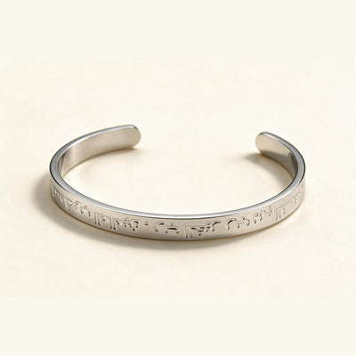 Inscribed Silver Cuff — Silver-tone wide cuff with engraved lettering (styled on model)