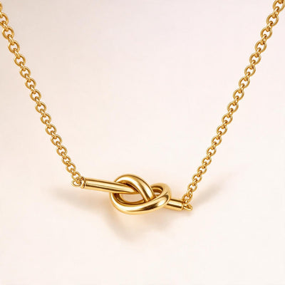 Twisted Gold Necklace — Minimal twisted gold-tone necklace (styled on model)
