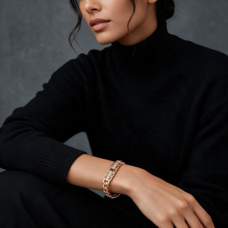 Bamboo & Ruby Twisted Bracelet — Rose gold-tone twisted chain with bamboo links, pavé crystals and a ruby-toned clasp (altern