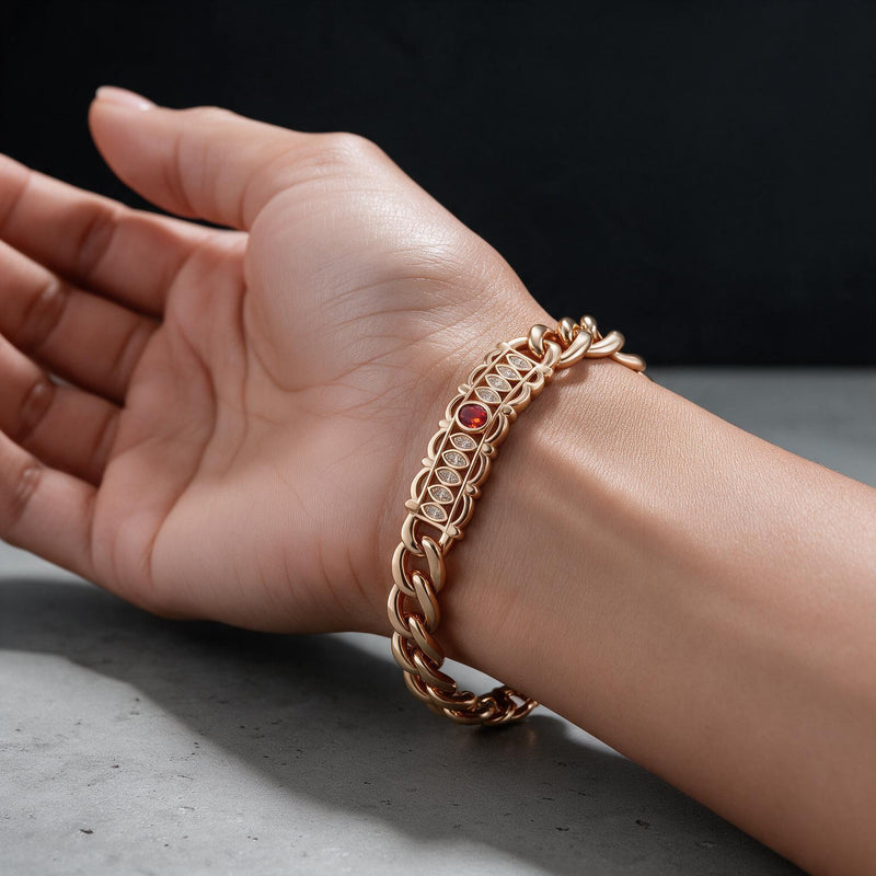 Bamboo & Ruby Twisted Bracelet — Rose gold-tone twisted chain with bamboo links, pavé crystals and a ruby-toned clasp (close-