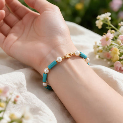 Sky Turquoise & Pearl Bracelet — Turquoise tube beads and white pearls, strung on gold-tone metal (close-up detail)